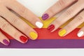 Multicolored bright saturated manicure on short nails close-up. Royalty Free Stock Photo