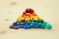 Multicolored buttons, close up. Color rainbow buttons on wooden background Royalty Free Stock Photo