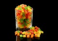 Multicolored candied fruits in a glass