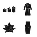 Multicolored candles with a flame, a blue robe with a belt, a lotus flower with petals, a bottle of cream. Spa set