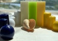 Colorful candles, small and large, seashell