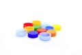 Multicolored caps from plastic bottles on white background Royalty Free Stock Photo