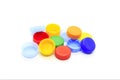 Multicolored caps from plastic bottles on white background Royalty Free Stock Photo