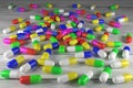 Multicolored capsules of medical preparations close-up. 3D rendering