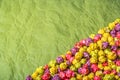 Multicolored caramel popcorn on wrapping paper. Backgrounds and textures.