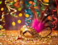 Multicolored carnival still life with mask, serpentine and confetti Royalty Free Stock Photo