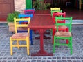 Multicolored chairs in outdoor greek restaurant, Crete, Greece. Royalty Free Stock Photo