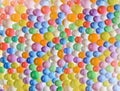 Multicolored cheerful background with the texture of hydrogel balls. Water absorbent balls Royalty Free Stock Photo