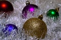 Multicolored Christmas balls in tinsel