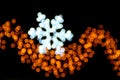 Snowflake made of ligths blurred on a black background Royalty Free Stock Photo