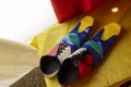 multicolored clown shoes backstage at a circus