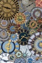 Multicolored collection of ancient church tower clocks on a pile