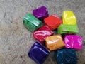 Multicolored color powder packets used in festivals Royalty Free Stock Photo