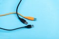 Multicolored computer cable USB isolated on blue Royalty Free Stock Photo