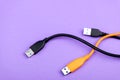 Multicolored computer cable USB isolated on purple Royalty Free Stock Photo