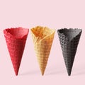 Multicolored cones for ice cream on a pink background Royalty Free Stock Photo