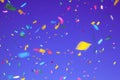 multicolored confetti on ultra violet background. Concept of holiday backdrop Royalty Free Stock Photo