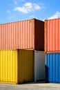 Multicolored containers stacked in an industrial park