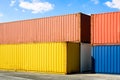 Multicolored containers stacked in an industrial park