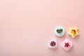 Multicolored cookie molds cutters on pink background with copy space for your advertisement and text. Baking concept. Flat lay. Royalty Free Stock Photo