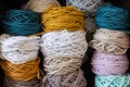 Multicolored cotton balls of yarn and ropes for macrame close up Royalty Free Stock Photo