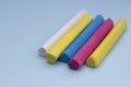 Multicolored crayons on a blue background, isolated Royalty Free Stock Photo