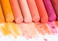 Multicolored crayons, pastel. Yellow, pink, red, crimson. Painted Pastels