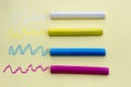 Multicolored crayons on yellow background, isolated Royalty Free Stock Photo