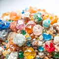 multicolored crystals of different sizes on a white background macro Royalty Free Stock Photo