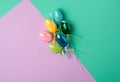 Multicolored decorative Easter eggs decorated with sequins on a blue lilac background Royalty Free Stock Photo