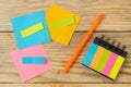 Multicolored different notes or sticky post-it on wooden office table background .mockup.