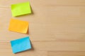 Multicolored different notes or sticky post-it on wooden office table background .mockup. Royalty Free Stock Photo