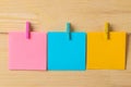 Multicolored different notes or sticky post-it on wooden office table background .mockup. Royalty Free Stock Photo