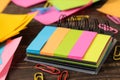 Multicolored different notes or sticky post-it on wooden office table background .mockup.