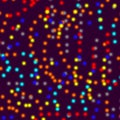 Multicolored dots on dark purple background blur