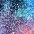 Multicolored dust particles splattered on black background Royalty Free Stock Photo