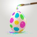 Multicolored Easter egg and paintbrush