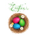 Multicolored Easter eggs in a bird`s nest