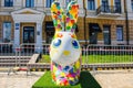 Multicolored easter white rabbit coated ink-stained, with big ears front view. Beautiful art decoration .Kyiv Kiev, Ukraine, apr