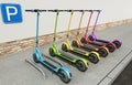 Multicolored electric scooters standing on the sidewalk. 3D illustration