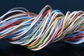 Multicolored electrical cable on dark background Royalty Free Stock Photo