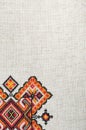 Multicolored embroidered element on linen cotton threads