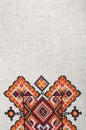 Multicolored embroidered element on linen cotton threads