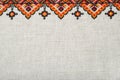 Multicolored embroidered element on linen cotton threads