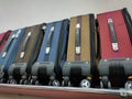 Multicolored fabric suitcases on wheels