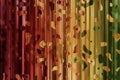 Multicolored fancy vertical lines with different shaped spots, bright abstract background