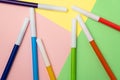 Multicolored felt-tip pens on background of colored paper Royalty Free Stock Photo