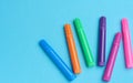 Multicolored felt-tip pens on a blue background, top view Royalty Free Stock Photo