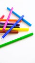 Multicolored felt-tip pens on a white background