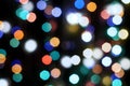 Multicolored festive lights on a black background screensaver backdrop